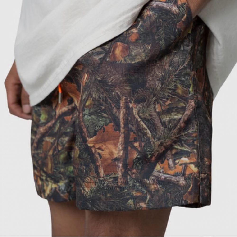 MNML Camouflage Patterned Shorts with Orange Accent